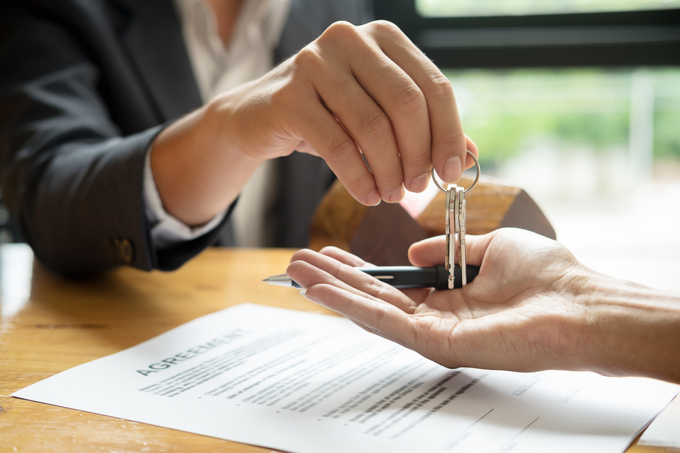 Real Estate Agent Giving Key to Client