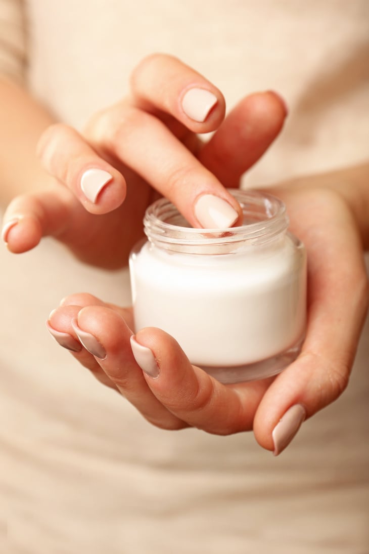 A Woman Holding a Jar with Cream 